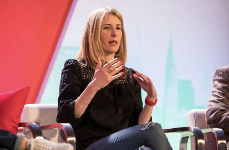 Heidi Isern speaking on a panel at a retail industry conference
